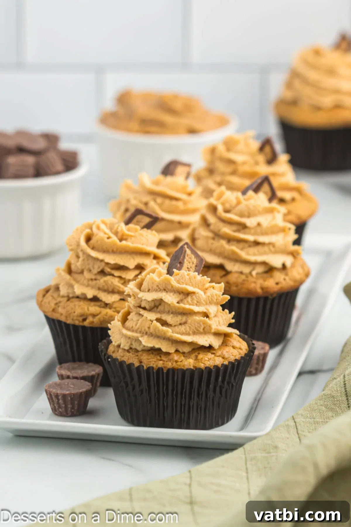 Heavenly Peanut Butter Cupcakes 2 Peanut Butter cupcakes on a platter.