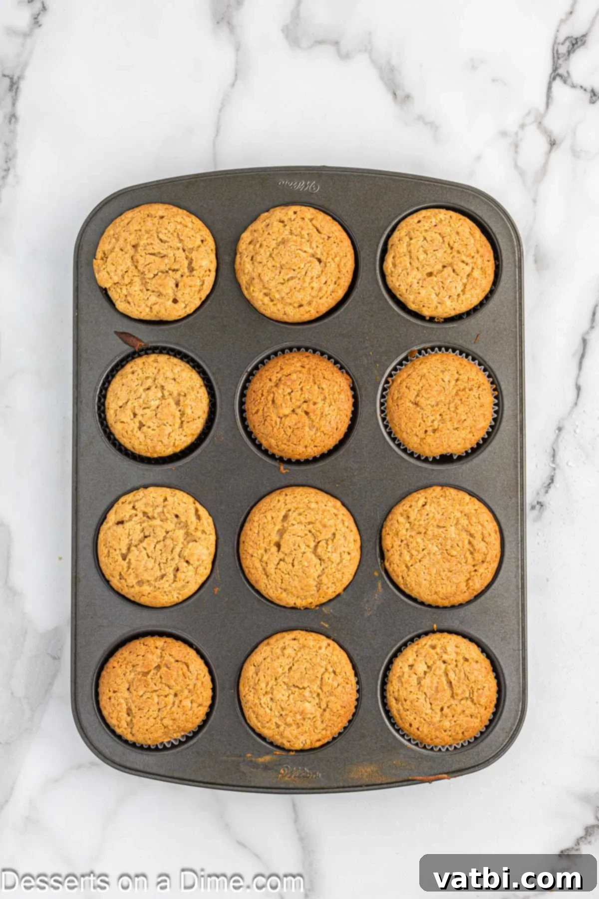 Heavenly Peanut Butter Cupcakes 7 Cupcakes in pan cooling.