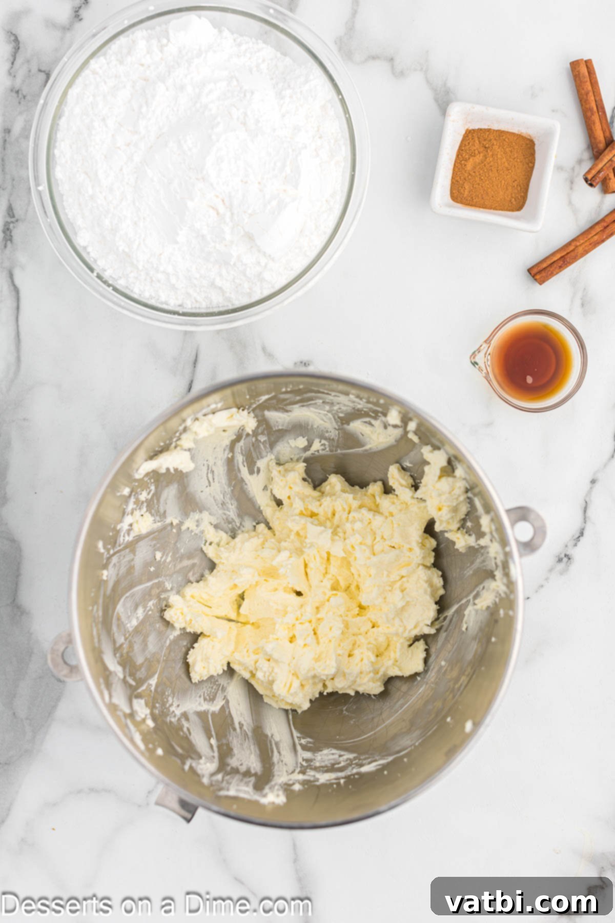 Irresistible Cinnamon Cream Cheese Frosting 4 A mixing bowl containing softened butter, light and ready for creaming with cream cheese.