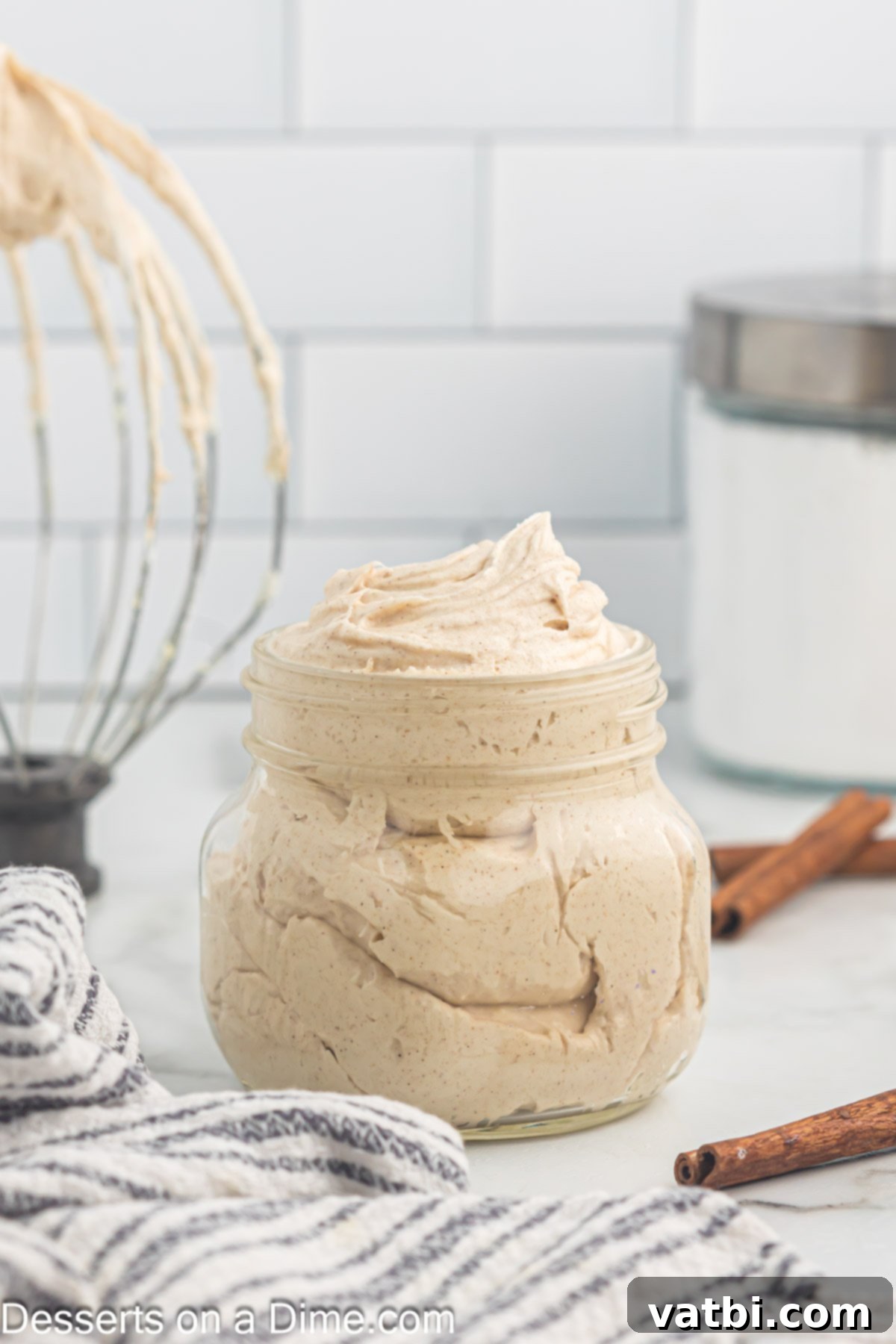Irresistible Cinnamon Cream Cheese Frosting 7 Finished cinnamon cream cheese frosting neatly stored in a glass mason jar, chilled and ready to use.