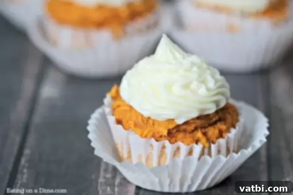 Pumpkin spice cupcakes with cream cheese frosting.