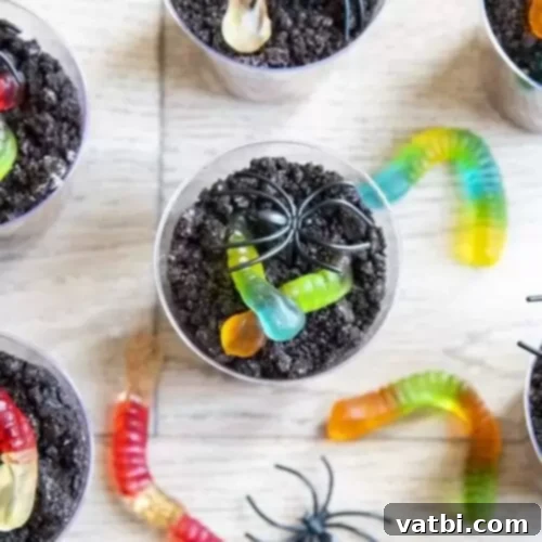 Halloween pudding cups with worms in a cup.