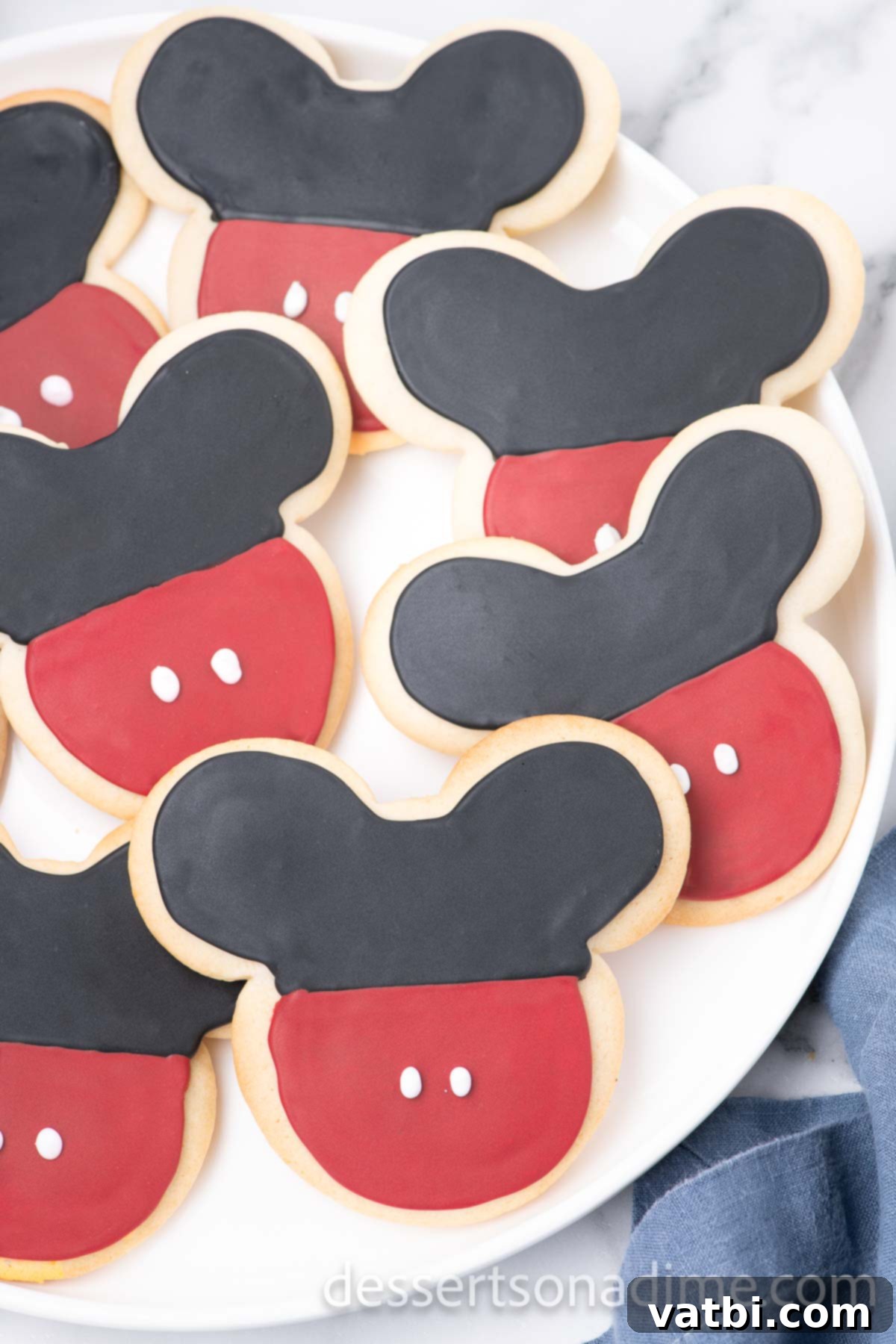Magical Mickey Bakes 15 Finished Mickey Mouse cookies beautifully arranged on a platter.