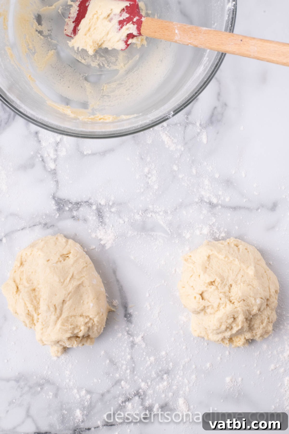 Magical Mickey Bakes 7 Cookie dough divided into several sections, ready for rolling.