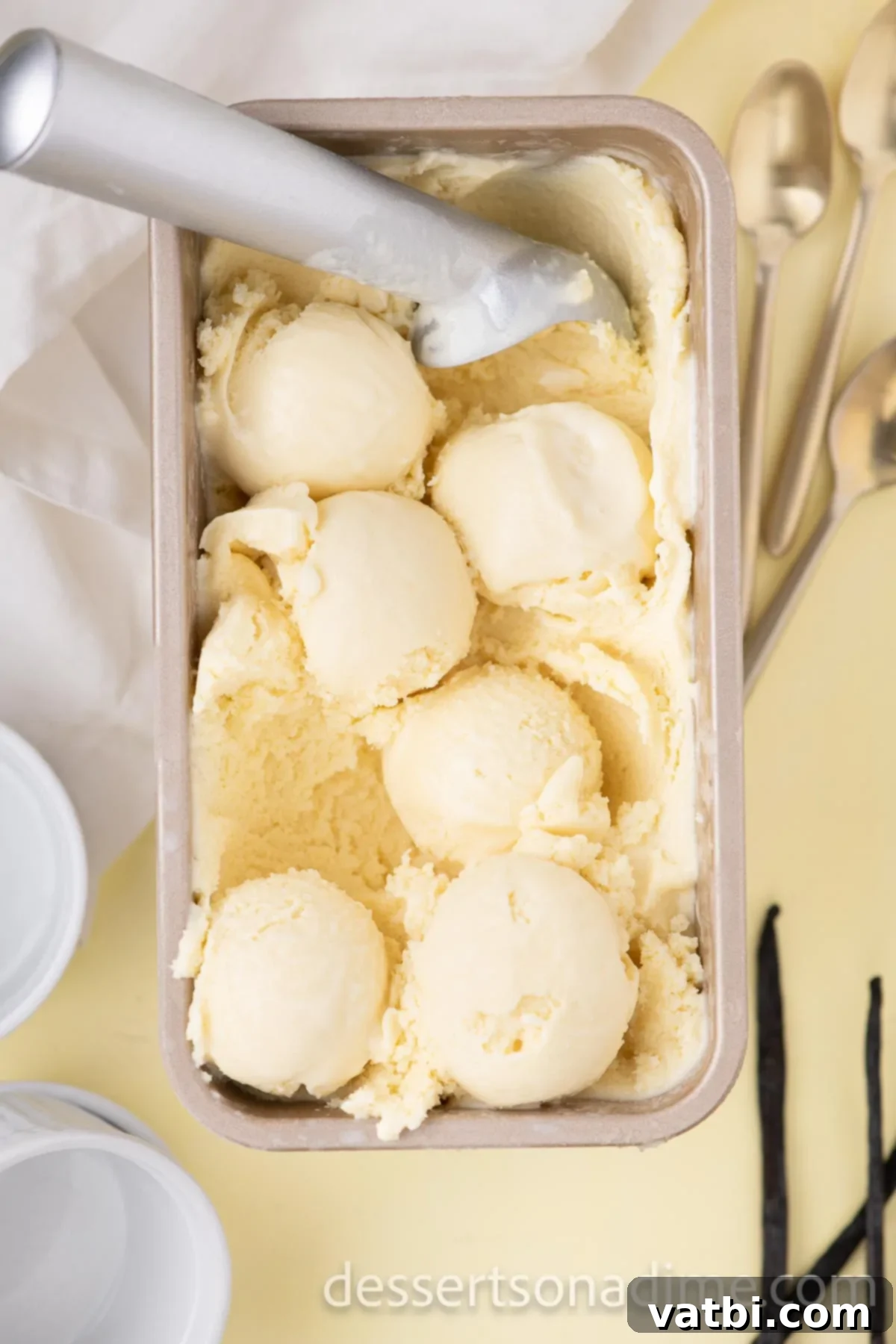 Your Own Scoop of Gelato Heaven 12 A scoop of homemade gelato being taken from a loaf pan, demonstrating its perfect, firm yet scoopable consistency.