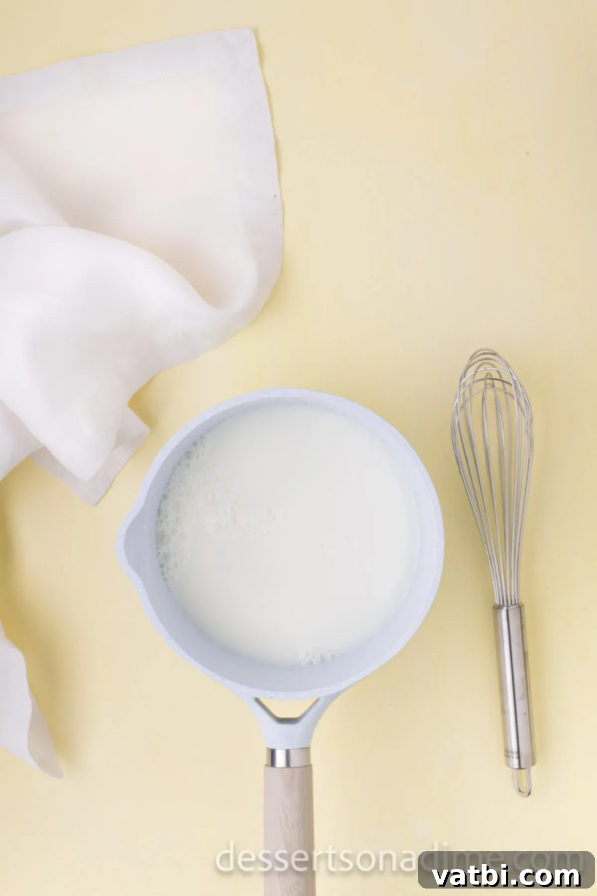 Your Own Scoop of Gelato Heaven 4 Milk gently simmering in a saucepan over low heat, preparing for the gelato base.