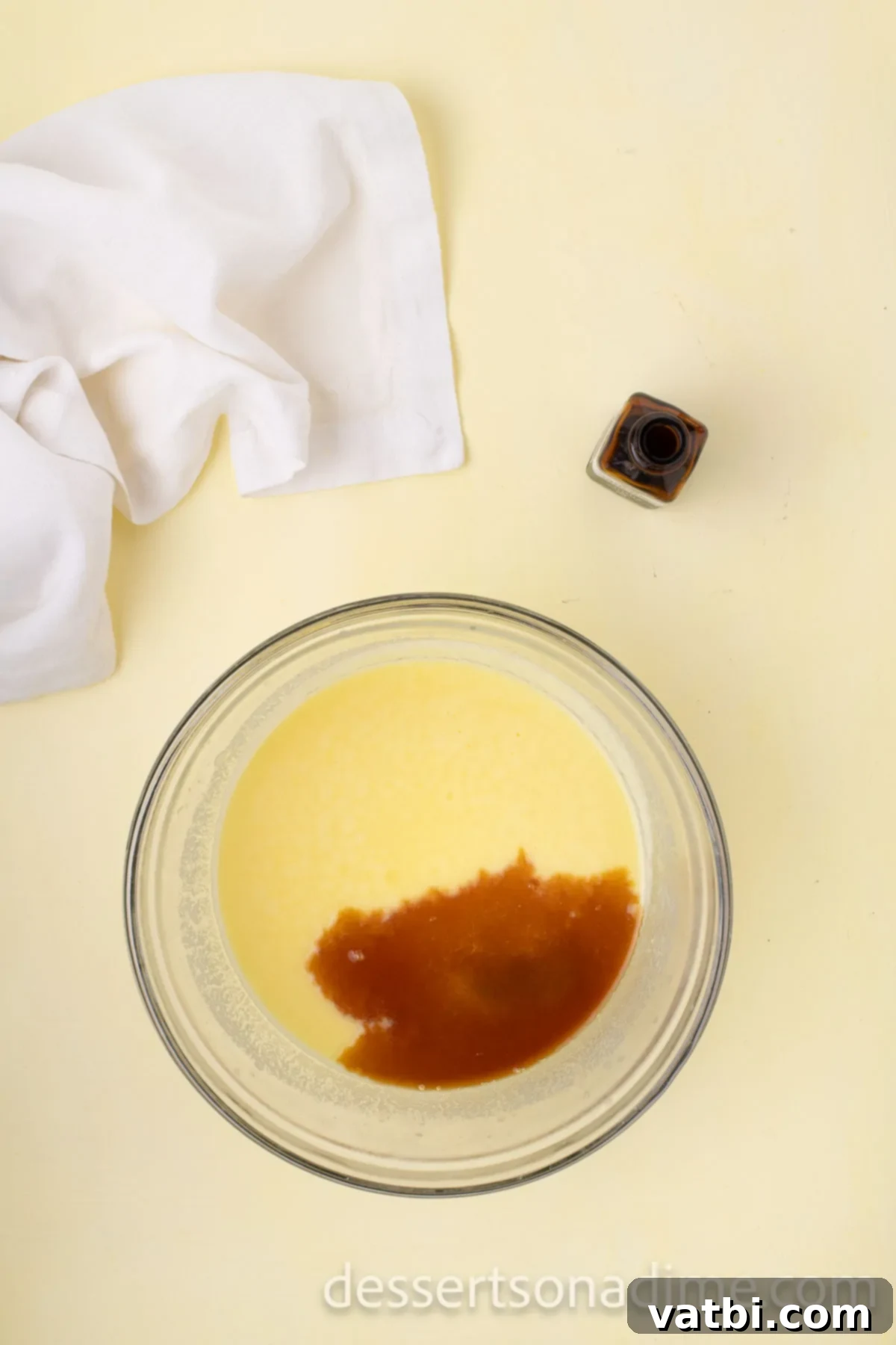 Your Own Scoop of Gelato Heaven 8 Smooth custard mixture after being strained, with vanilla extract added, cooling in a bowl before chilling.