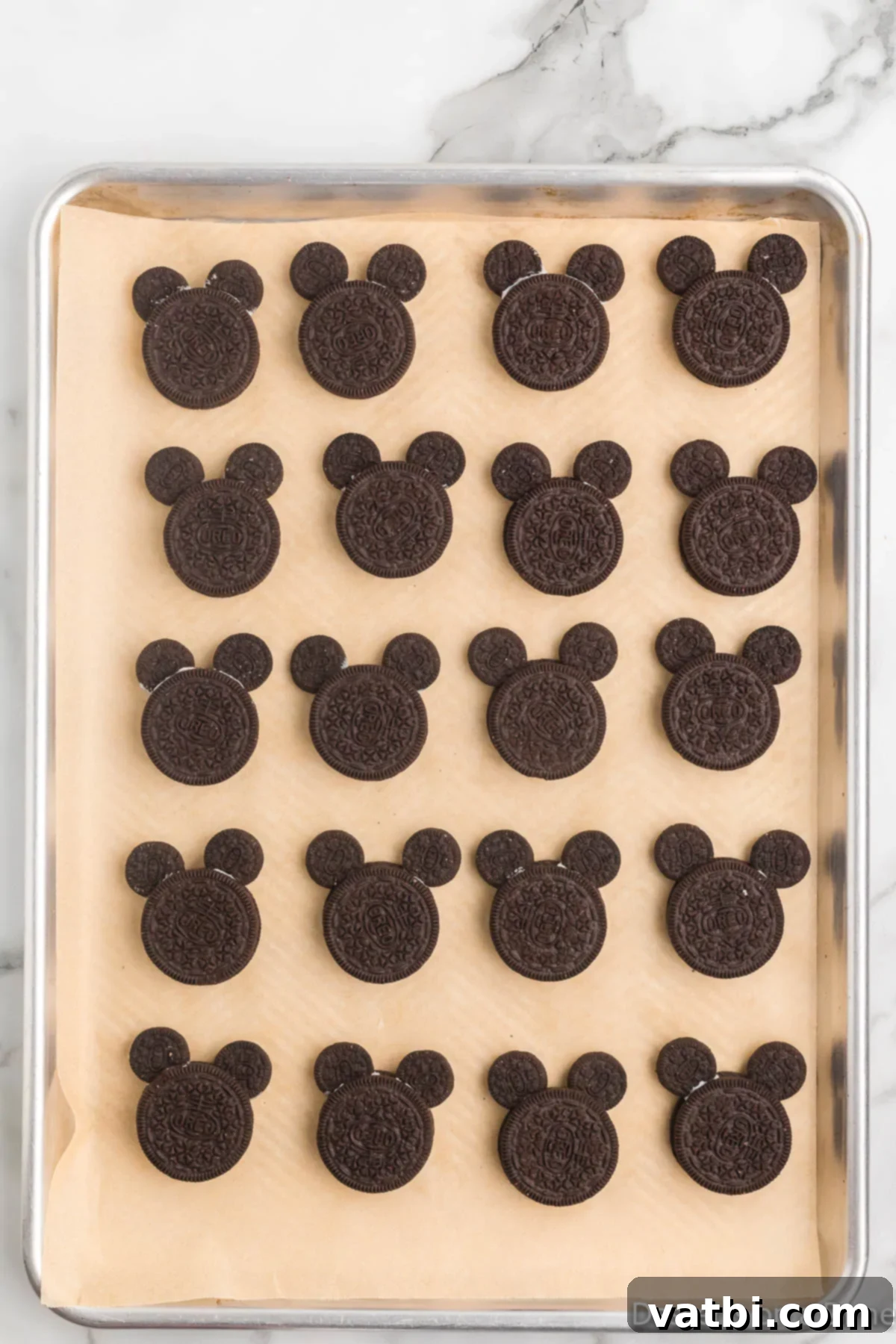 Disney Mickey Mouse Oreo Treats 6 Cookies on baking pan with mini cookies inserted for ears.