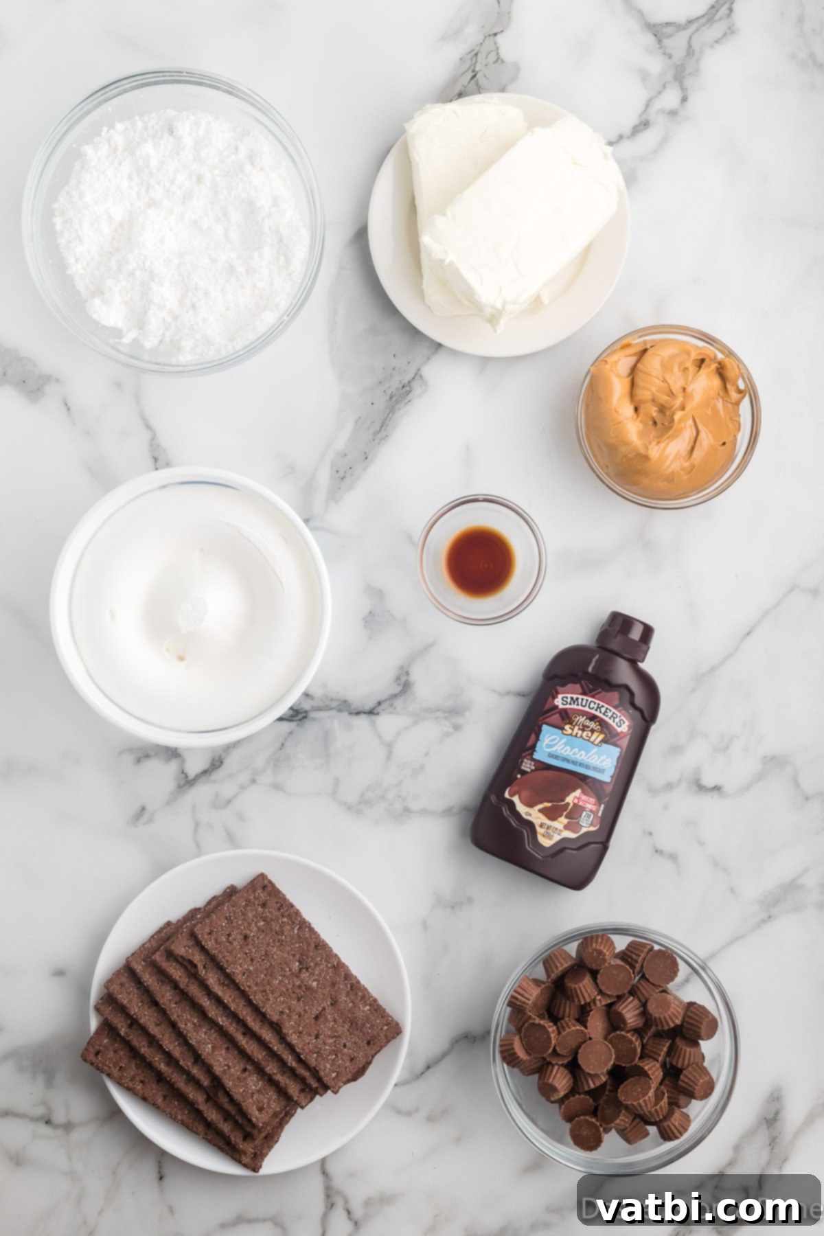 No-Bake Peanut Butter Bliss 3 Assortment of ingredients for Peanut Butter Icebox Cake, including chocolate graham crackers, cream cheese, peanut butter, powdered sugar, vanilla extract, whipped topping, chocolate magic shell, and mini Reese's peanut butter cups.