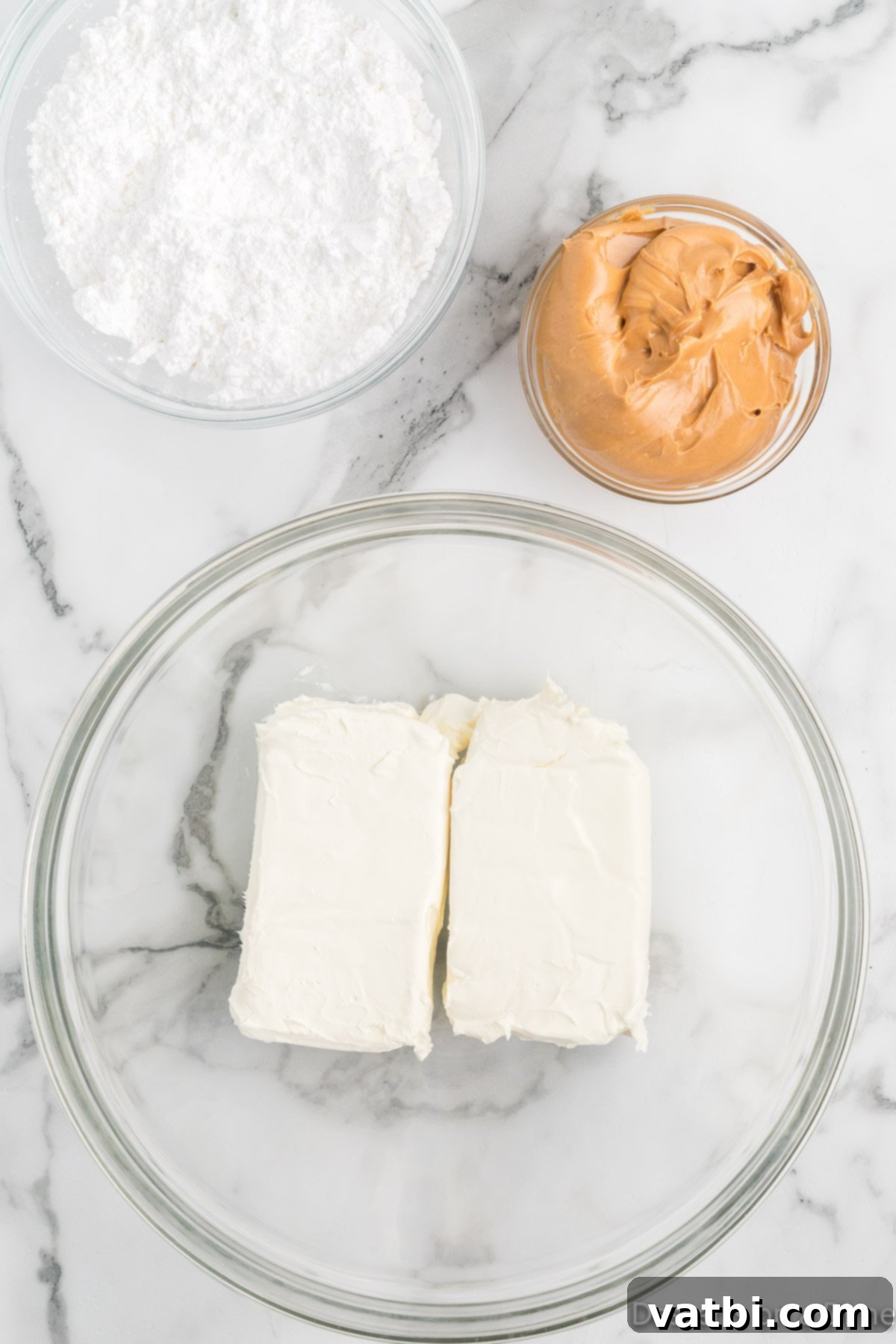 No-Bake Peanut Butter Bliss 4 Softened cream cheese in a mixing bowl, ready to be beaten.