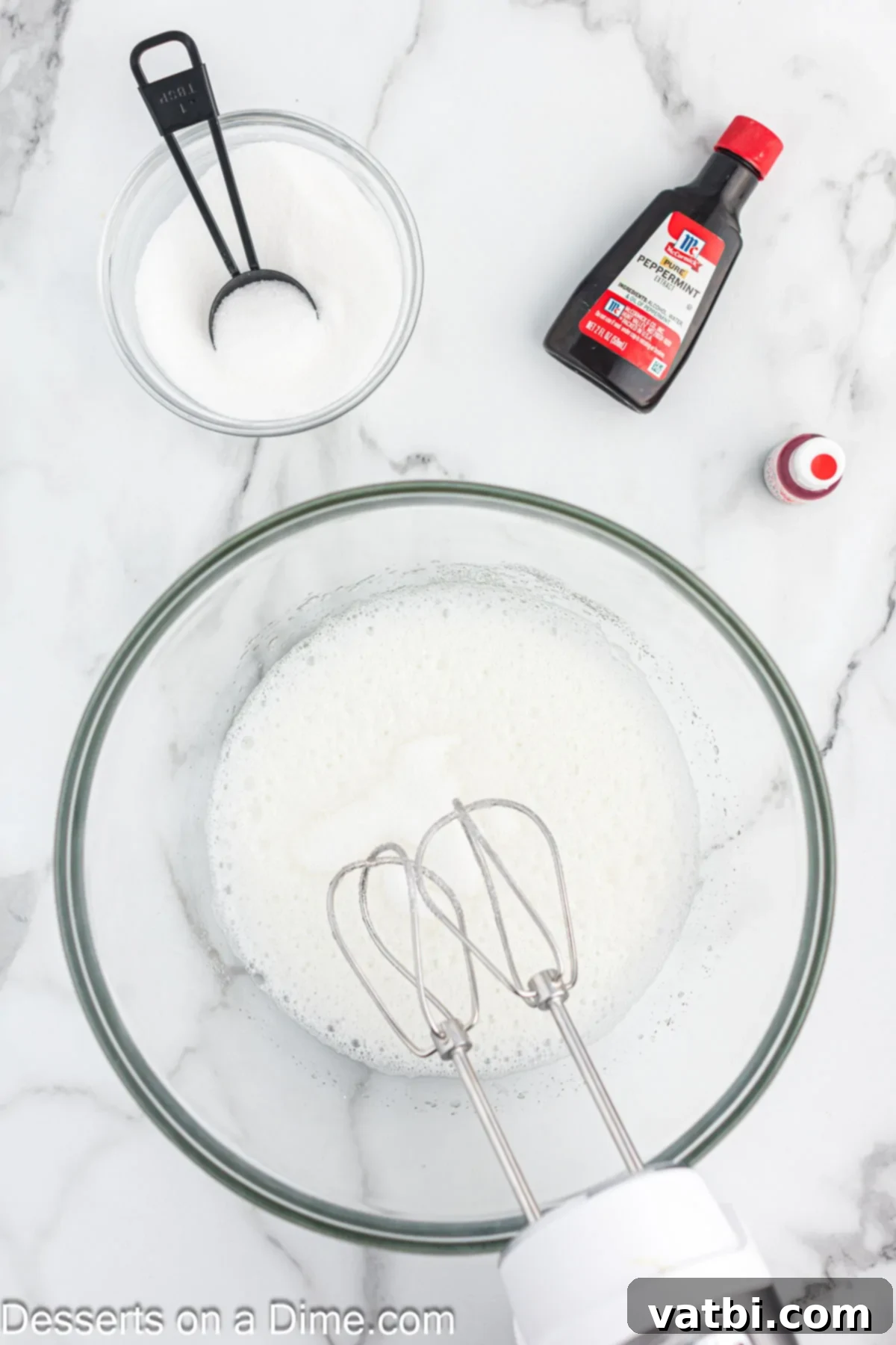 Crisp Peppermint Dream 5 Mixing bowl with egg whites and cream of tartar after sugar has been slowly added, forming glossy stiff peaks.