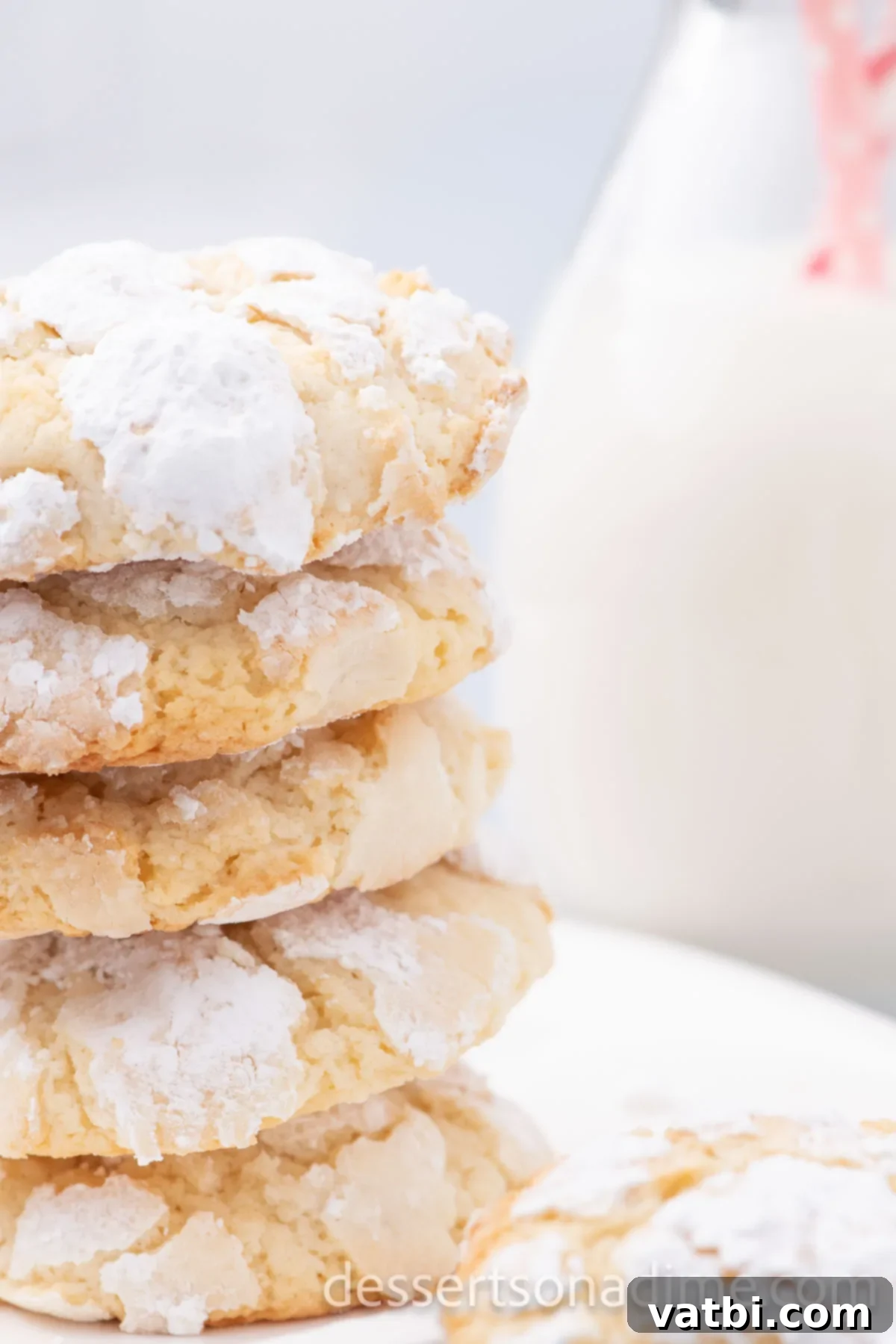 A beautiful stack of perfectly baked Ooey Gooey Butter Cookies, showcasing their soft texture and powdered sugar coating.