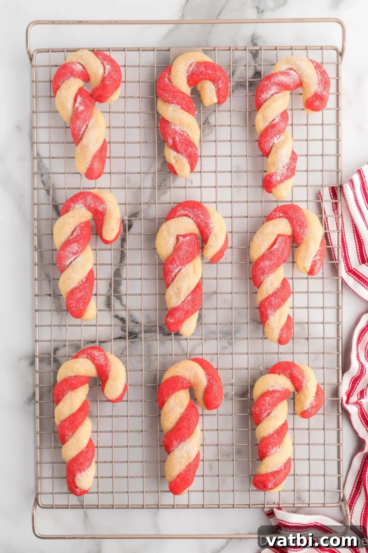 Twisted Peppermint Delights 12 Cookies on wire rack cooling.