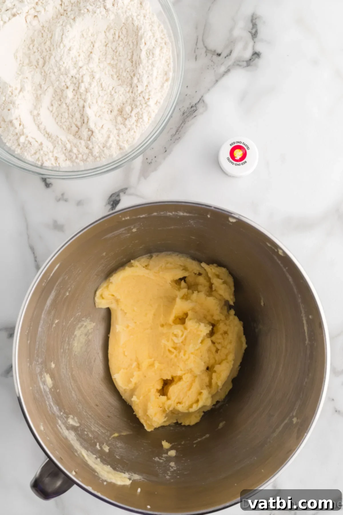 Twisted Peppermint Delights 5 Dry ingredients and butter being combined in mixing bowl.