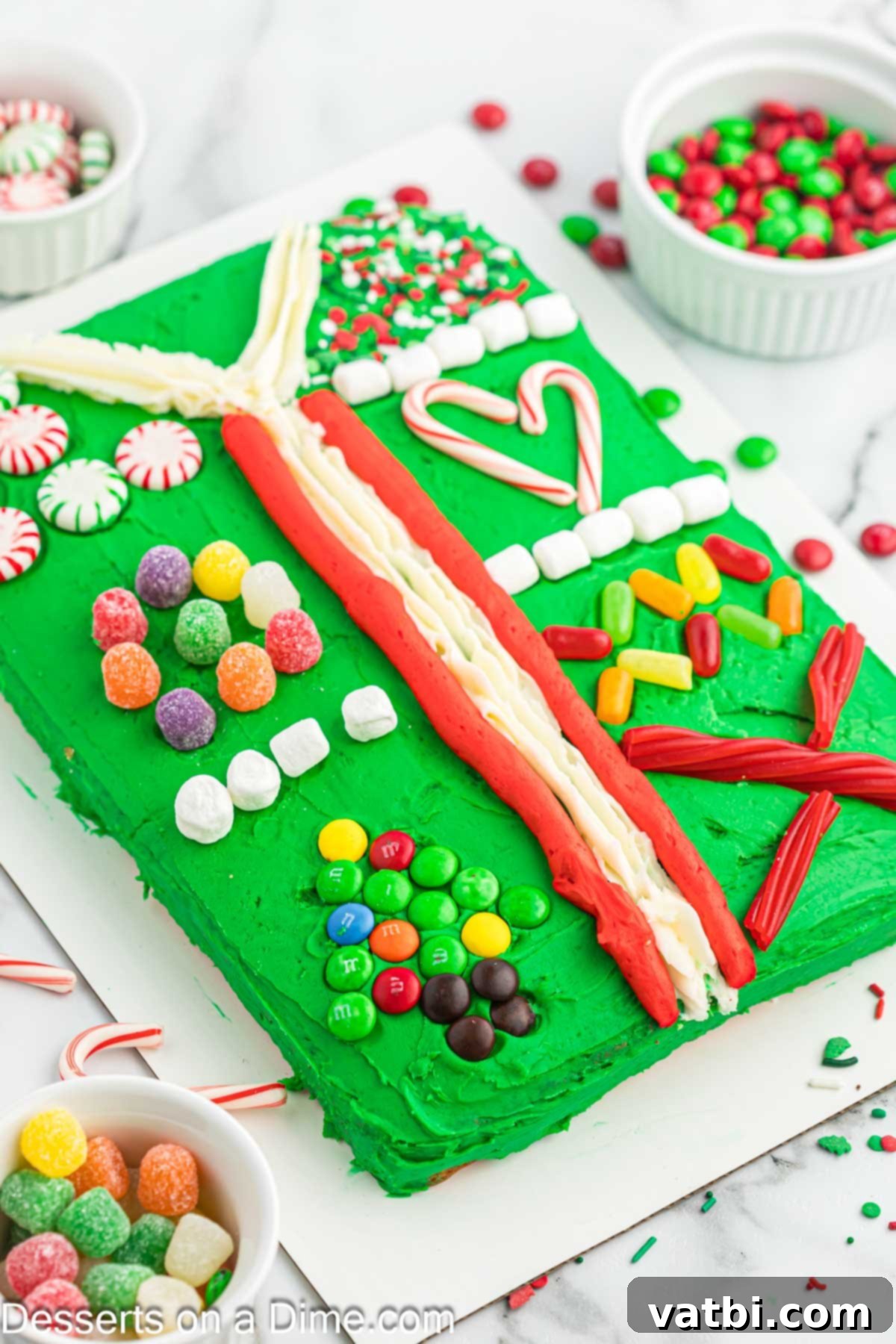 Completed Ugly Sweater Cake presented on a serving platter, vibrant and ready for a festive holiday party or gathering.