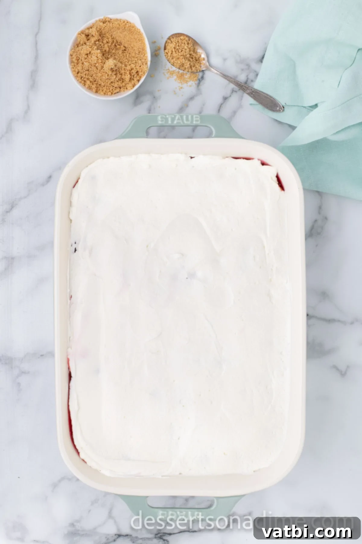 Crimson Craving 12 Top cream cheese layer spread out evenly, ready for the final garnish.