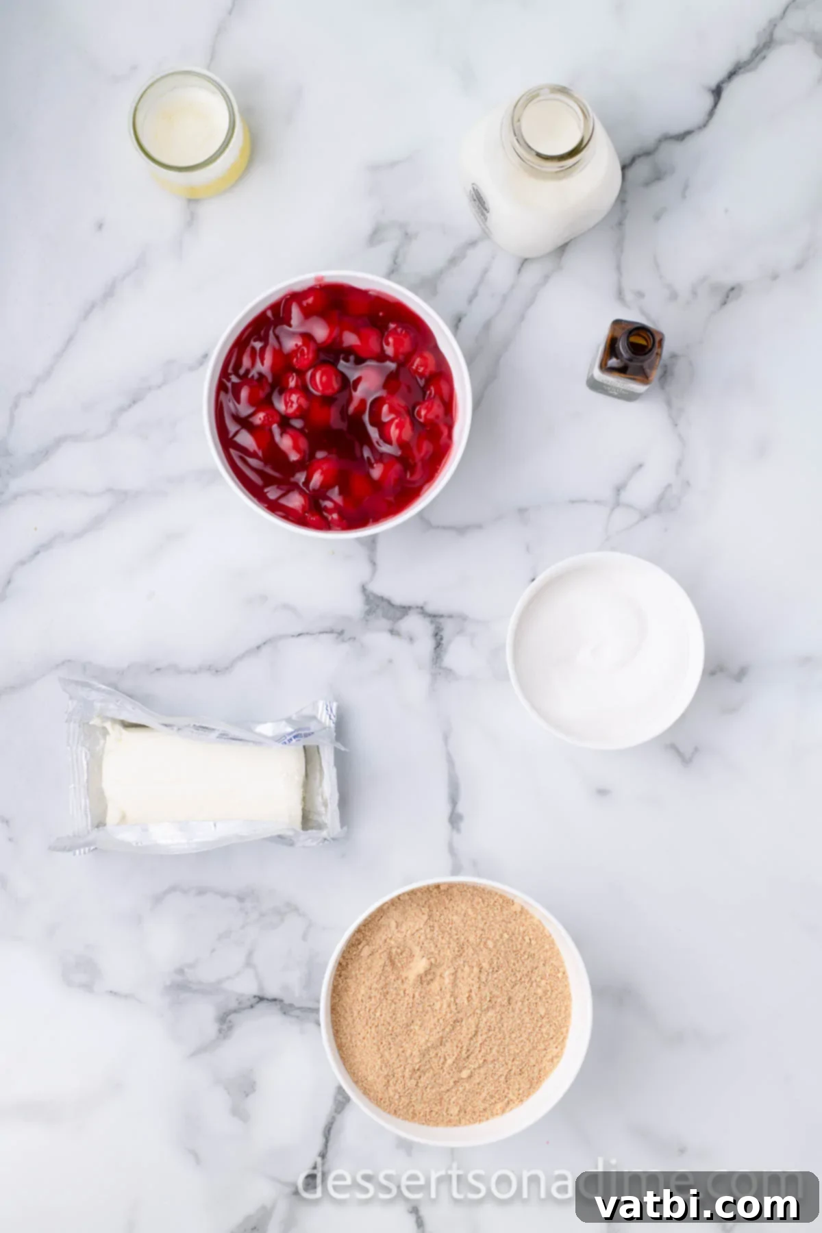 Crimson Craving 3 Ingredients for Cherry Yum Yum: cherry pie filling, cream cheese, graham cracker crumbs, vanilla extract, and heavy cream.