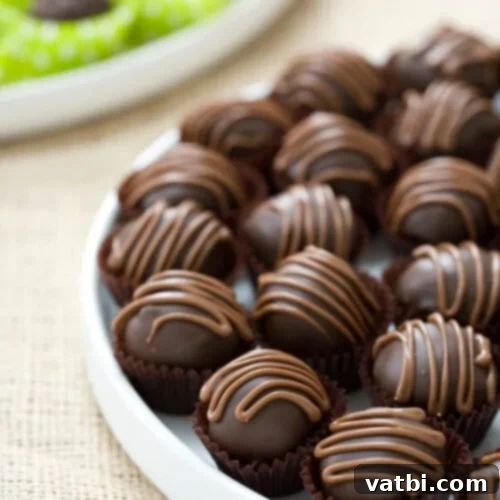 Decadent Mexican Chocolate Chip Cookie Dough Truffles, infused with cinnamon and cayenne pepper for a spicy kick.