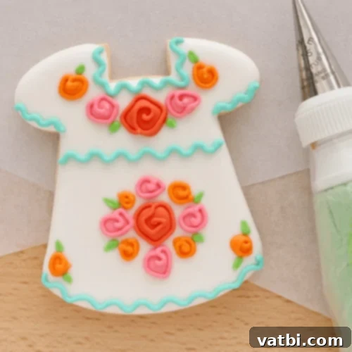 Exquisitely decorated Mexican Dress Cookies, inspired by traditional folk dresses, perfect for a fiesta.