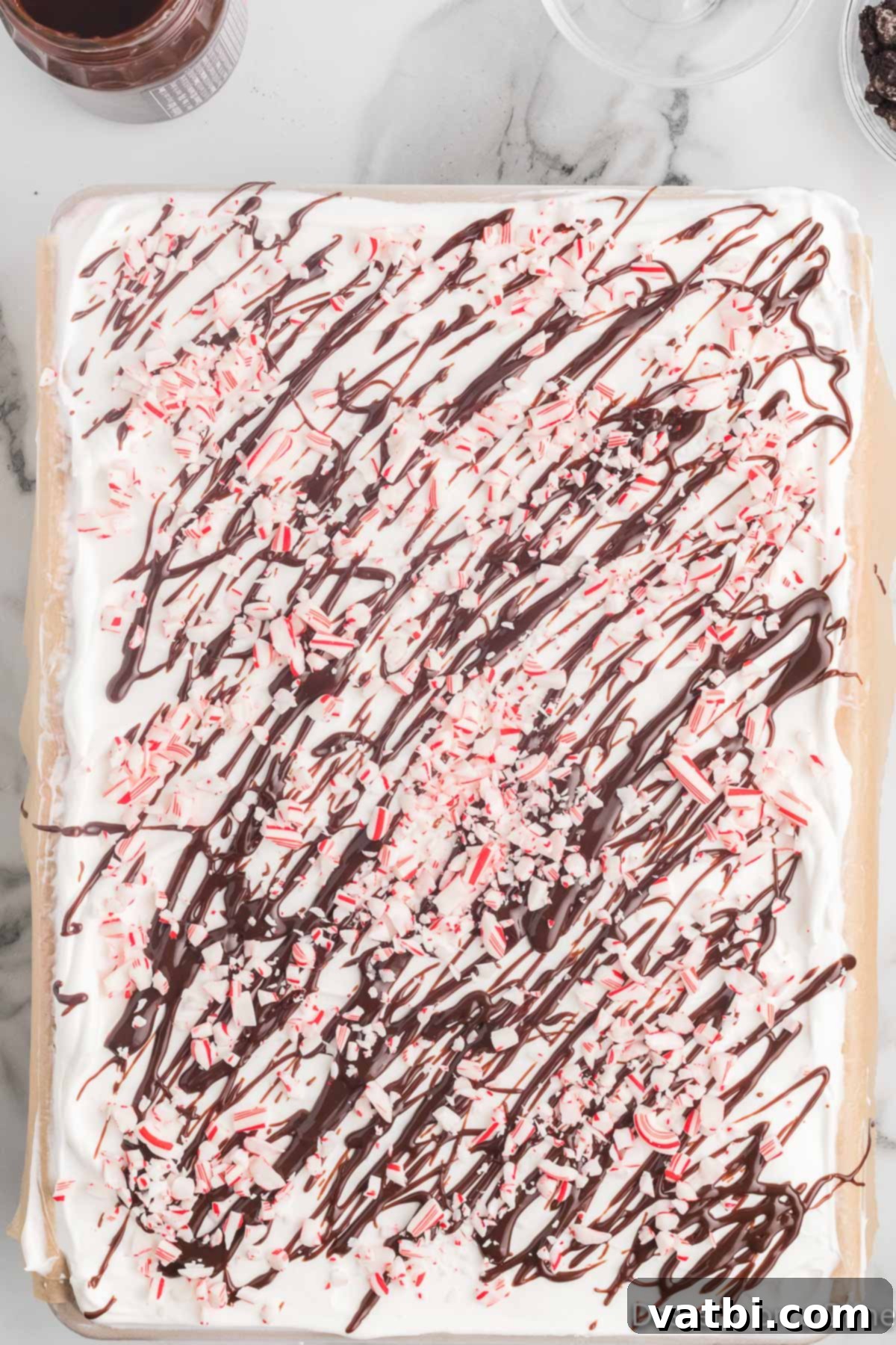 Festive Christmas Ice Cream Cake 11 Chocolate and crushed peppermint on top.