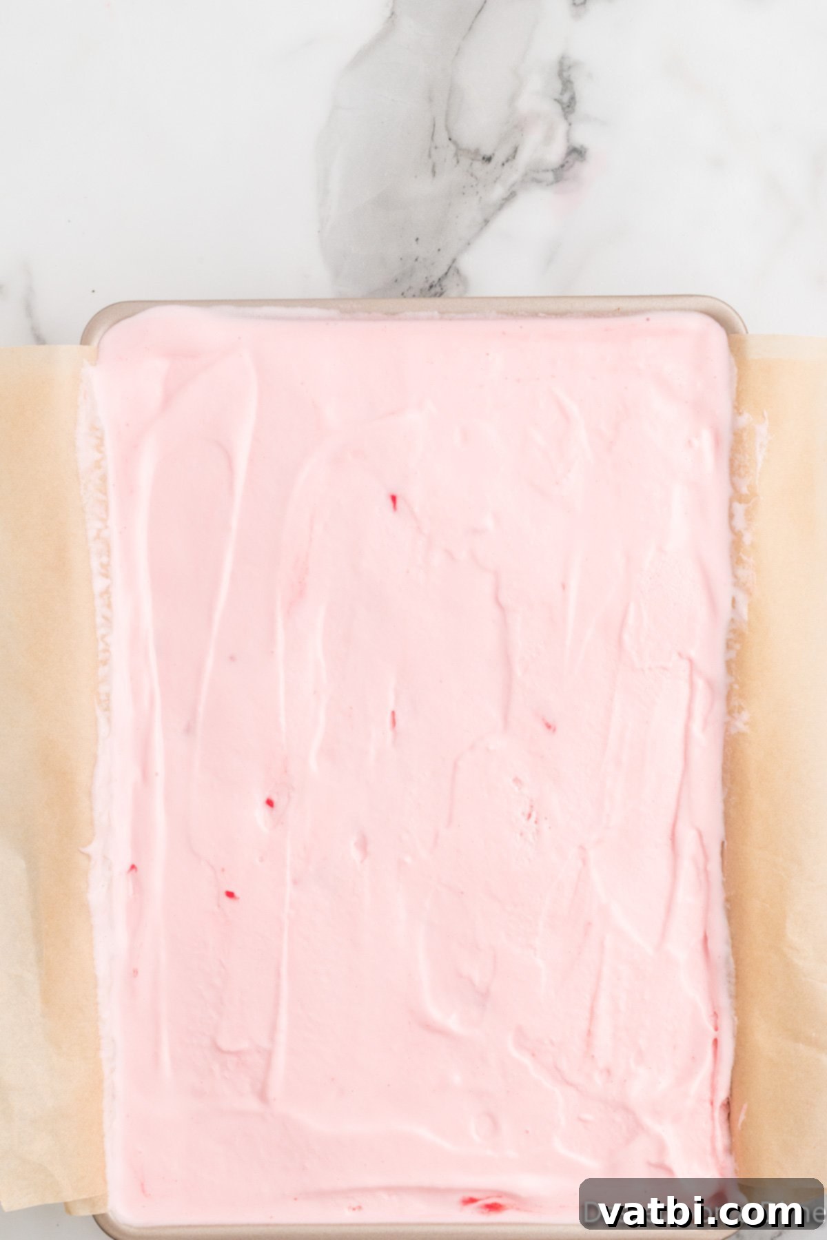 Festive Christmas Ice Cream Cake 9 More ice cream layered on top and spread out.