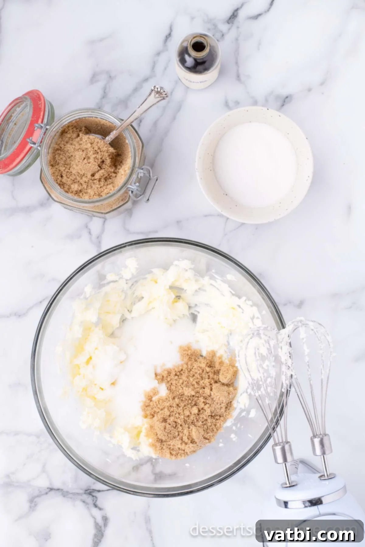Butter and sugars creamed together in a bowl. 
