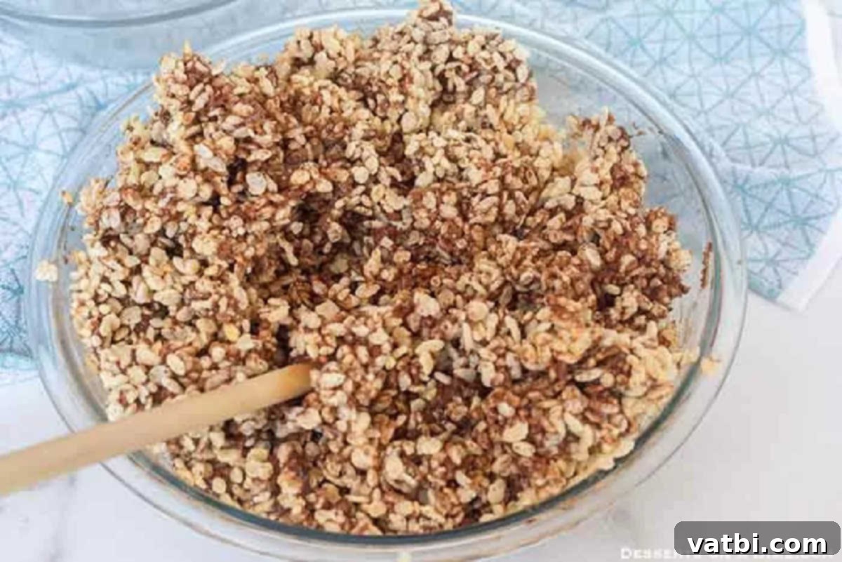Decadent Chocolate Krispie Squares 4 The fully combined chocolate and crispy rice cereal mixture, ready to be pressed into a pan.