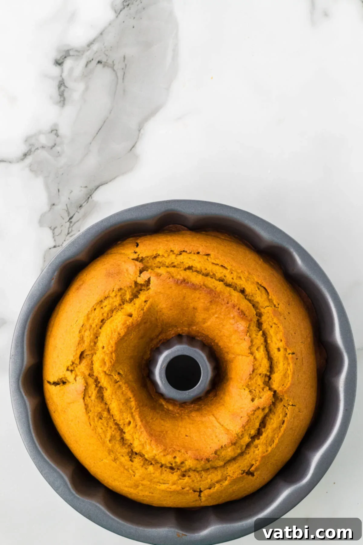 Golden Spiced Pumpkin Bundt 8 Cake baked and cooling.