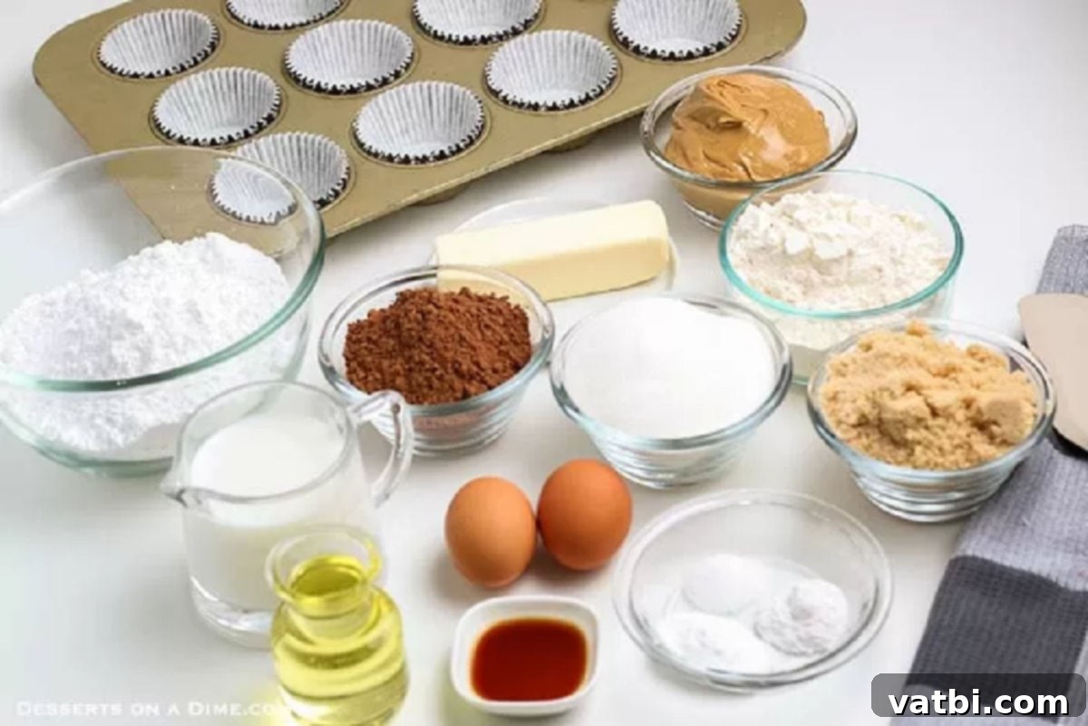 Chocolate and peanut butter fans will go crazy over Chocolate cupcakes with peanut butter frosting. Each bite is moist and delicious and so decadent. This recipe for homemade cupcakes makes baking from scratch easy. Try the best cupcakes with dark chocolate and peanut butter today. #dessertonadime #chocolatepeanutbuttercupcakes Ingredients needed for cupcakes - brown sugar, flour, cocoa powder, eggs, milk, oil, vanilla, butter, peanut butter, milk, powdered sugar.