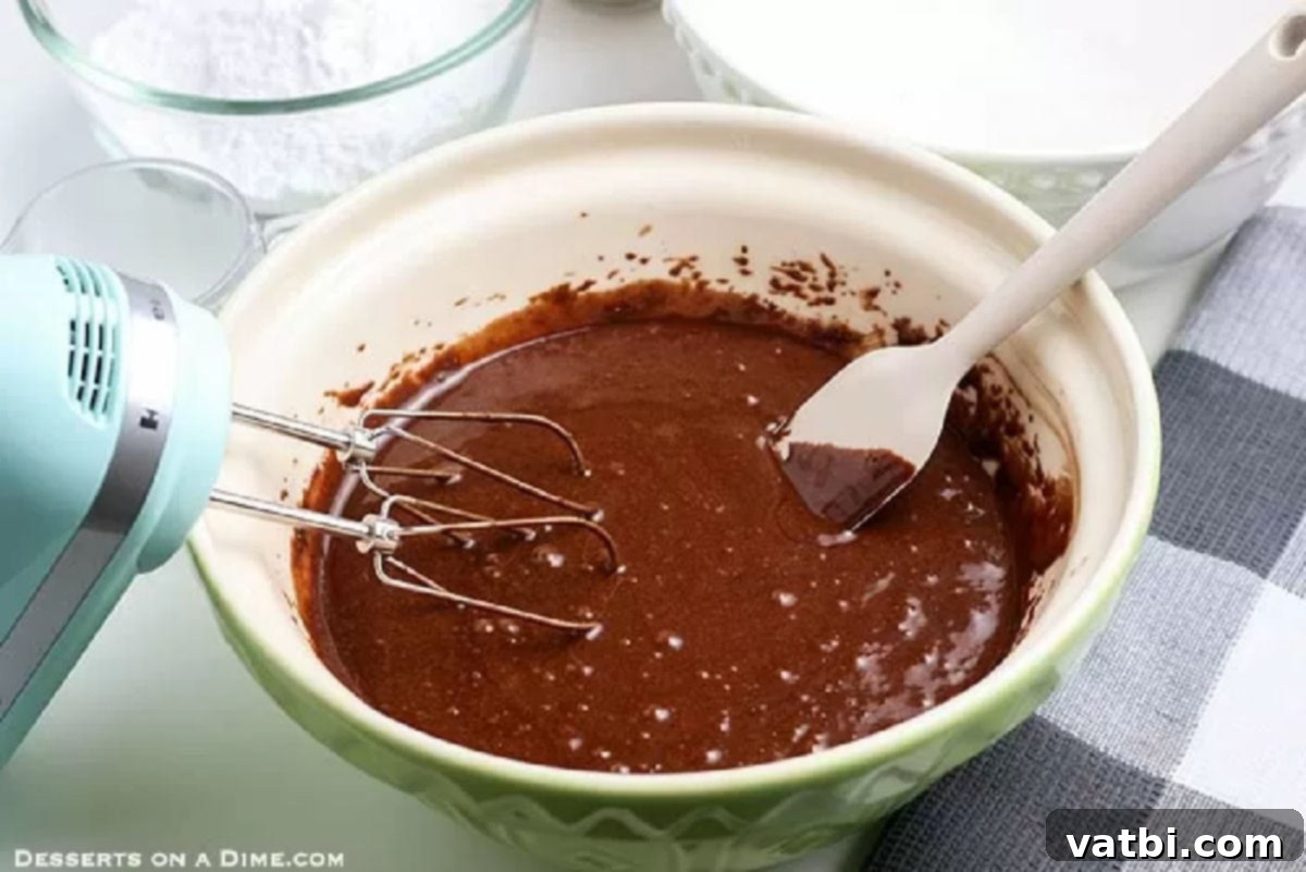 Decadent Chocolate Peanut Butter Cupcakes 3 Wet ingredients in a bowl.