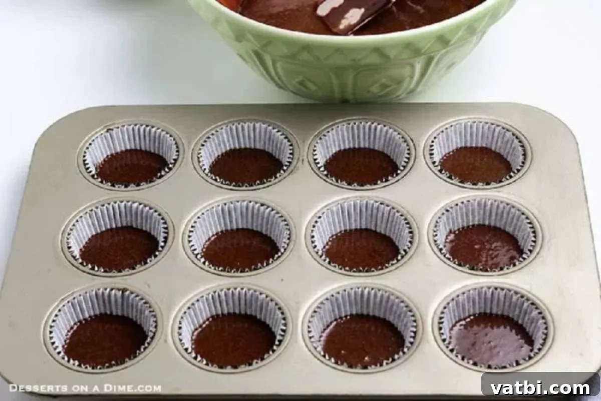 Decadent Chocolate Peanut Butter Cupcakes 4 Batter poured in muffin fin.