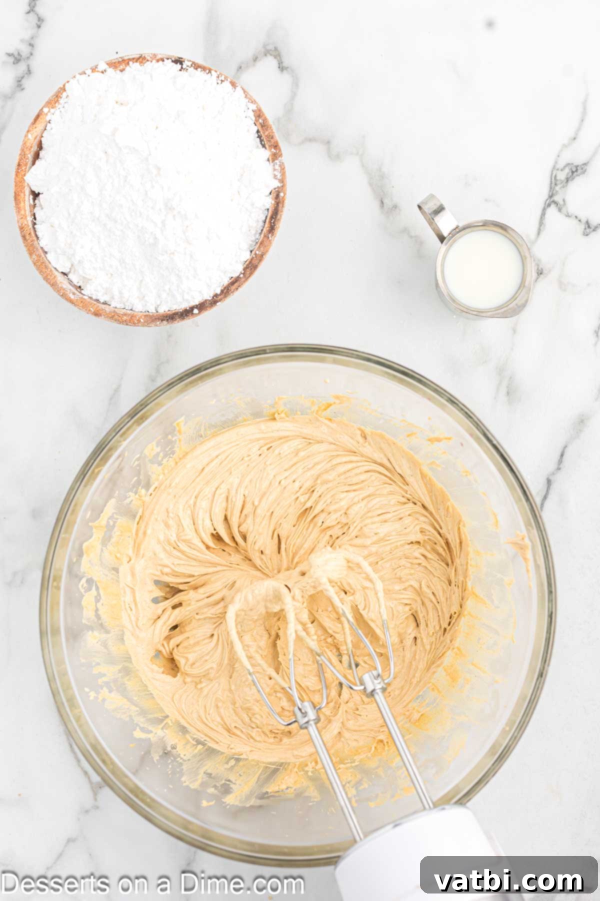 Decadent Peanut Butter Frosting 4 Mixing bowl with softened butter and creamy peanut butter combined and thoroughly creamed.