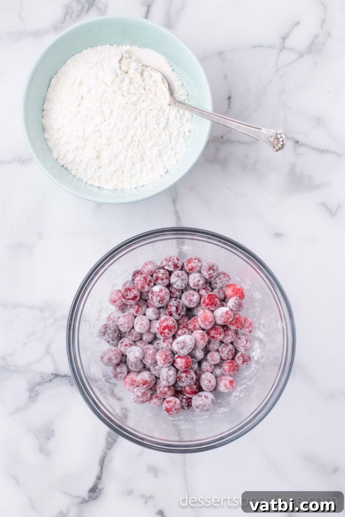 Bowl of cranberries coated in flour to prevent sinking.