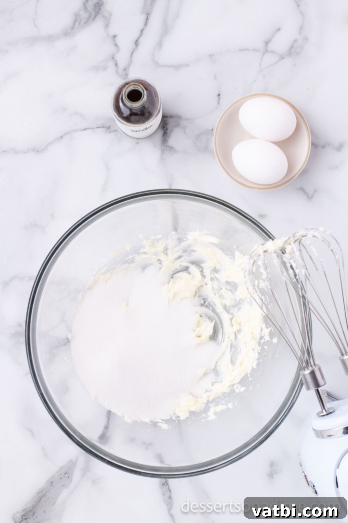 Bowl with butter and sugar being creamed together until light and fluffy.