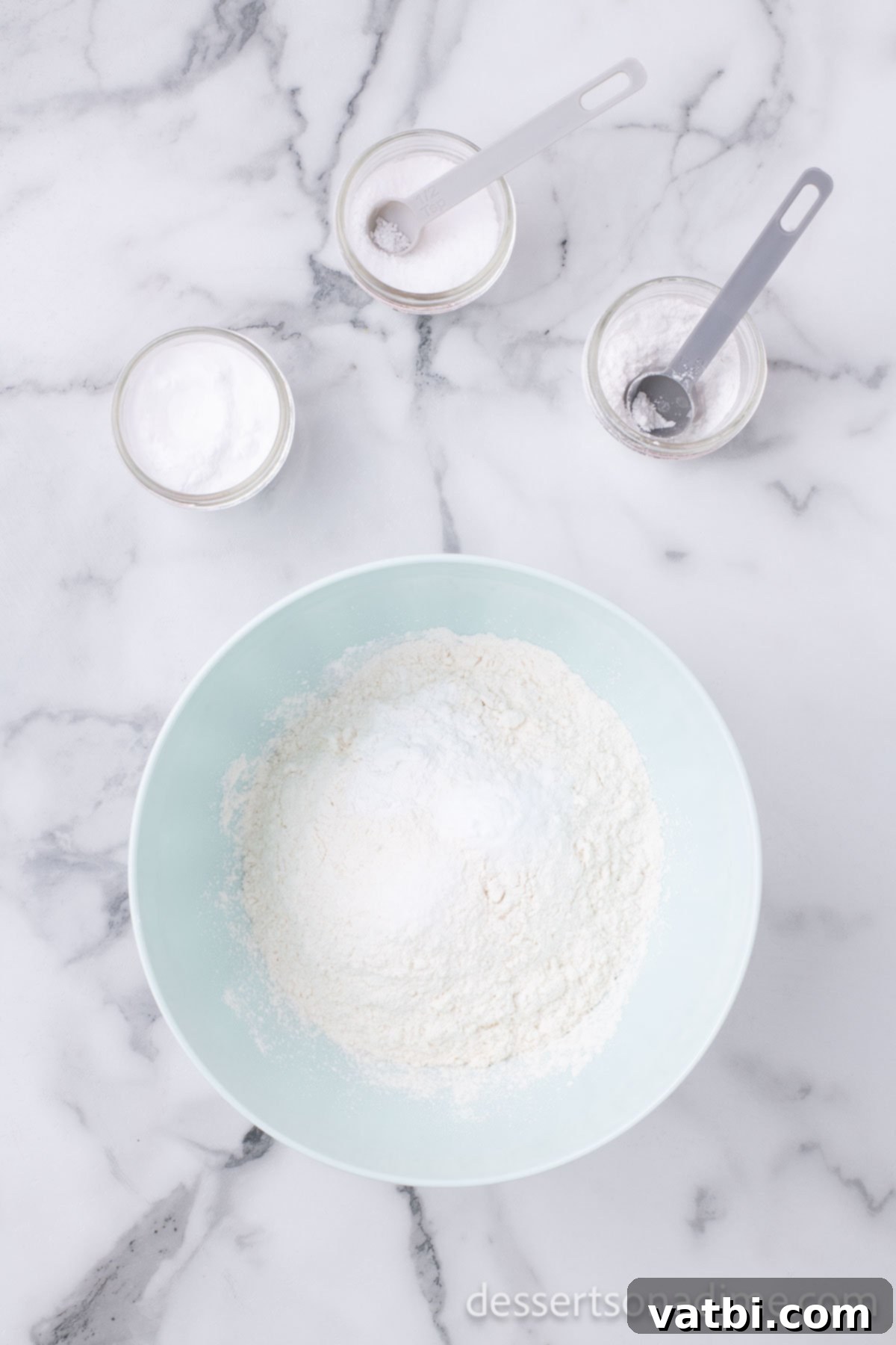 Separate bowl with dry ingredients being whisked together.
