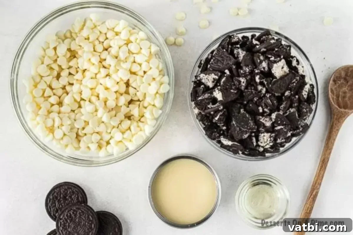 Oreo fans will go crazy over this super easy 3 ingredient Oreo fudge recipe. Oreo fudge is so easy to make and delicious with white chocolate and sweetened condensed milk. Learn how to make oreo fudge with this no bake three ingredient recipe. #dessertonadime #oreofudgerecipe Ingredients needed for 3-ingredient Oreo fudge: white chocolate chips, sweetened condensed milk, and crushed Oreos.