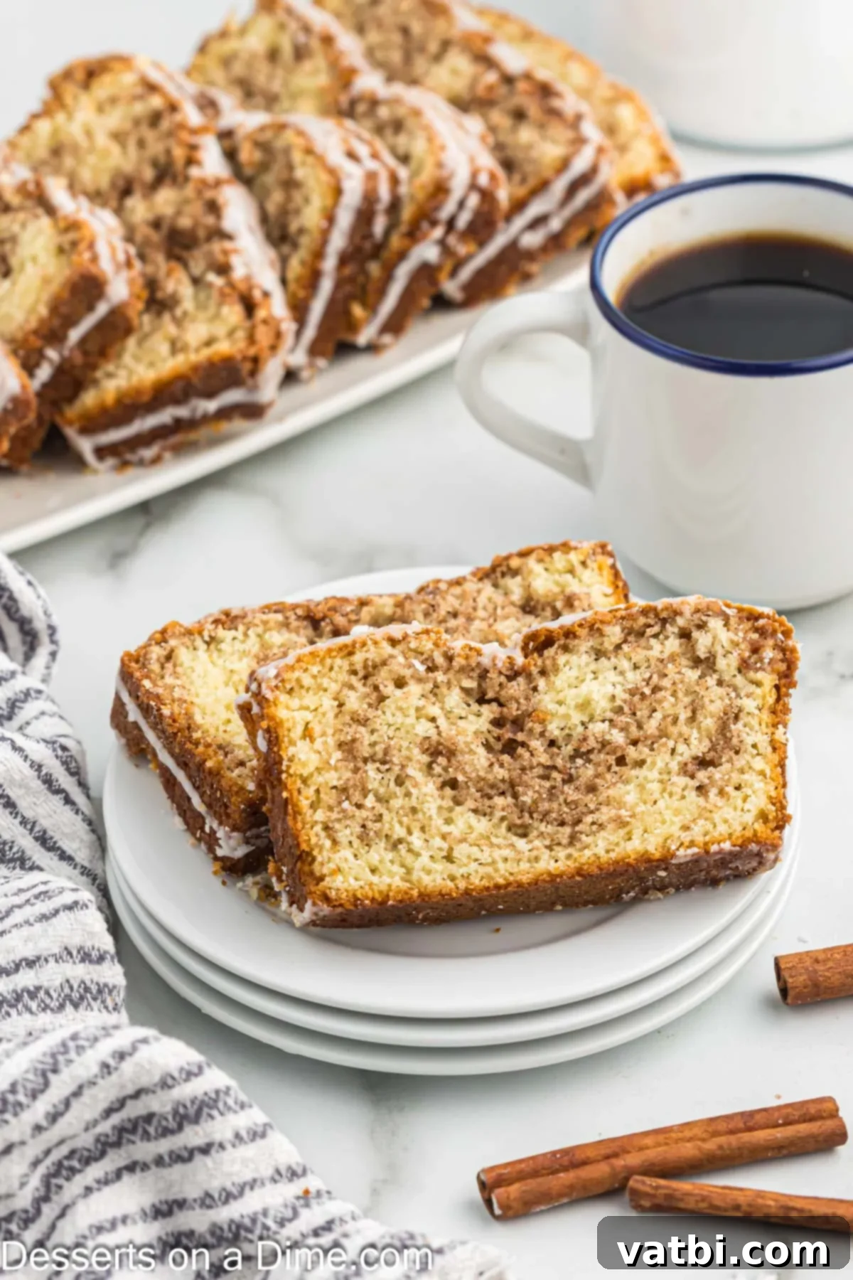 Cinnamon Swirl Bread 11 Slices of bread on a plate beside a cup of coffee.
