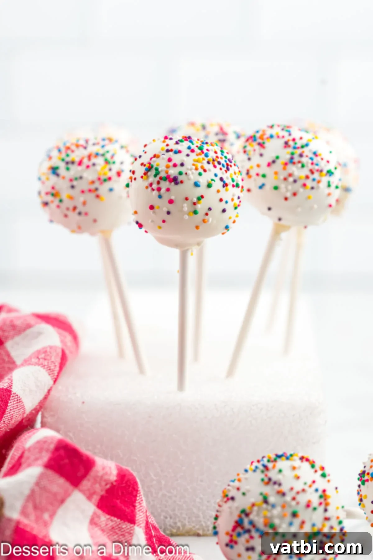 Mastering the Art of Cake Pops 11 Cake pops in block of Styrofoam.