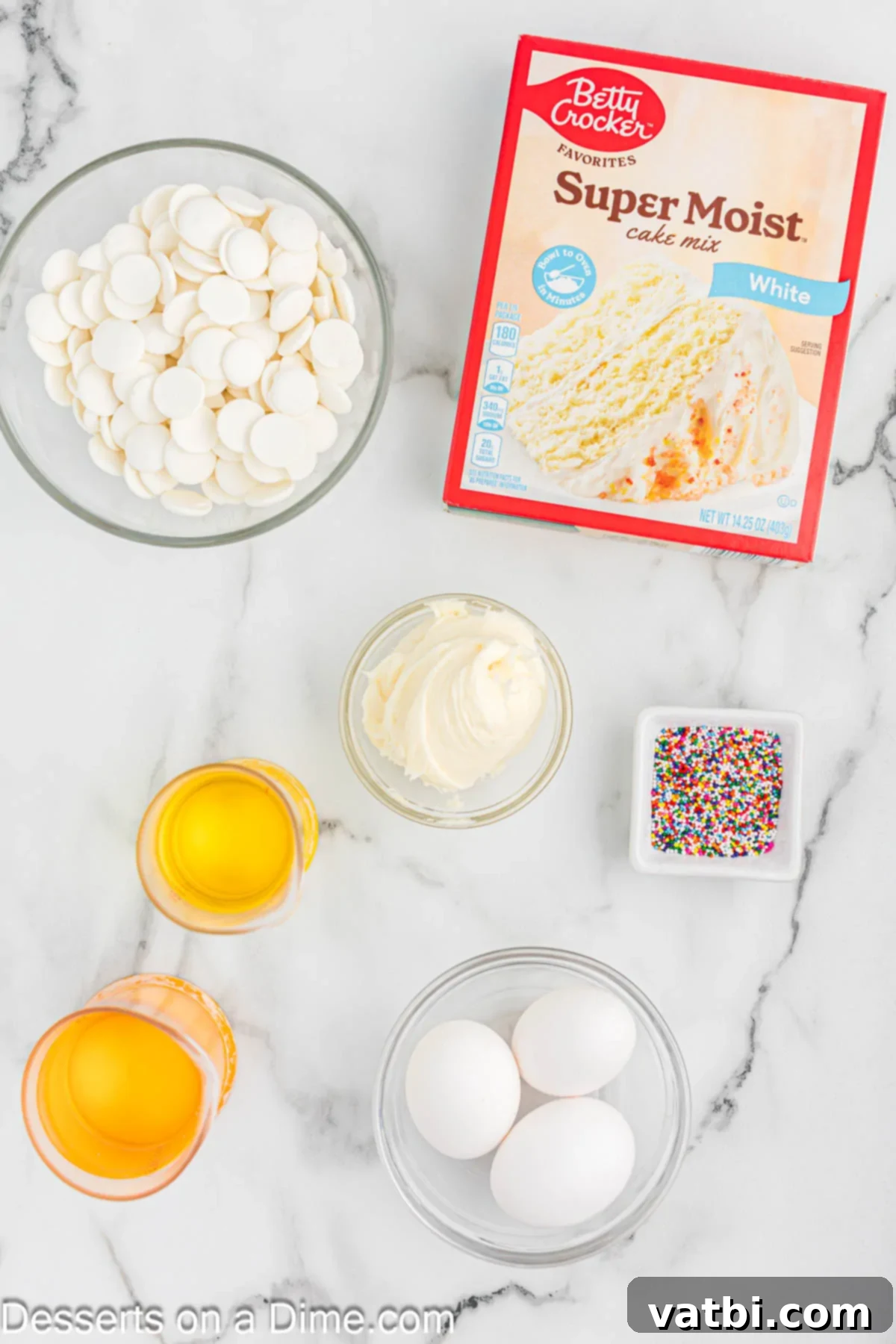 Mastering the Art of Cake Pops 3 Ingredients for cake pops - cake mix, candy melts, sprinkles, frosting, eggs, oil.