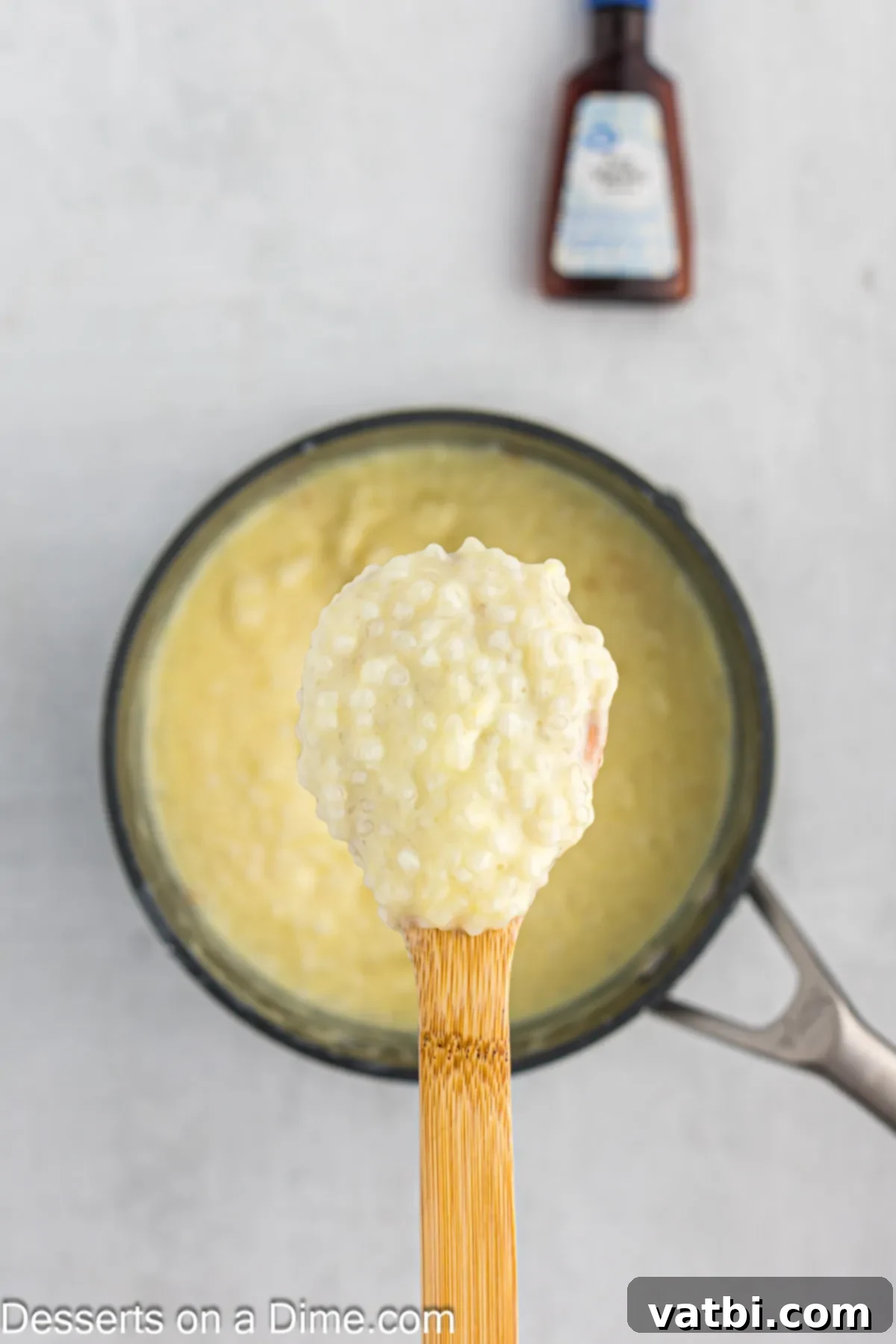Creamy Tapioca Pudding 9 Vanilla extract added to the finished pudding mixture, stirred with a wooden spoon.