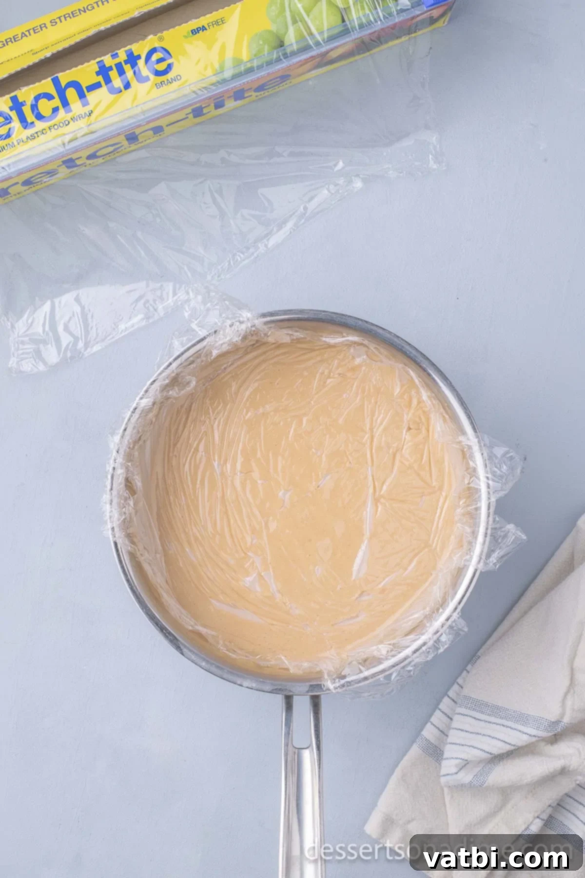Creamy Peanut Butter Delight 8 Plastic wrap on top of pudding.