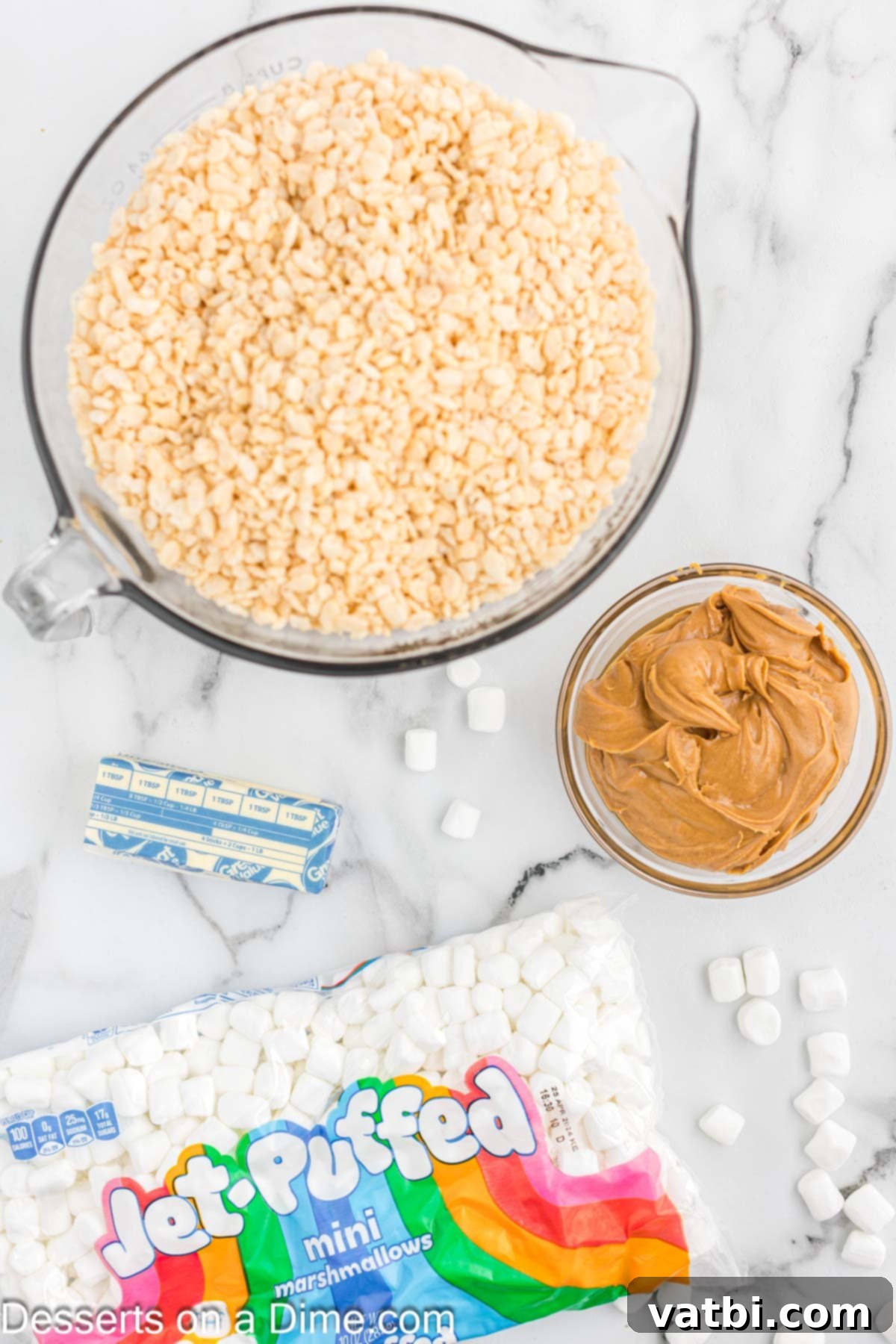 Peanut butter fans will love this easy recipe for homemade Peanut butter rice krispie treats. You only need 4 ingredients for chewy no bake rice krispie treats. This is the best dessert and so gooey and delicious with marshmallows! Try this fun recipe today. #dessertonadime #peanutbutterricekrispietreatsrecipe #ideas #microwave Ingredients for Peanut Butter Rice Krispie Treats: peanut butter, butter, mini marshmallows, and crispy rice cereal.