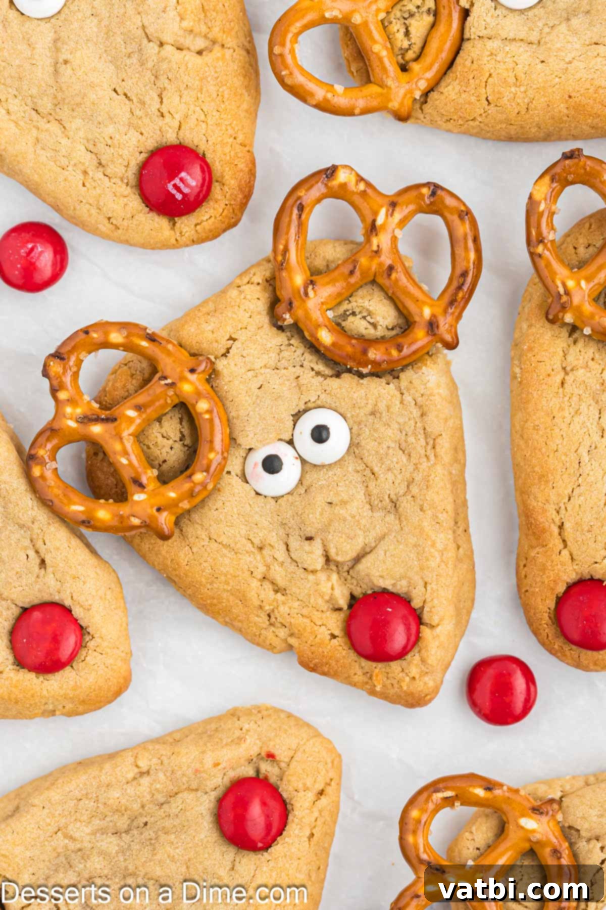 A festive platter of cute Reindeer Cookies with pretzel antlers and red M&M noses.