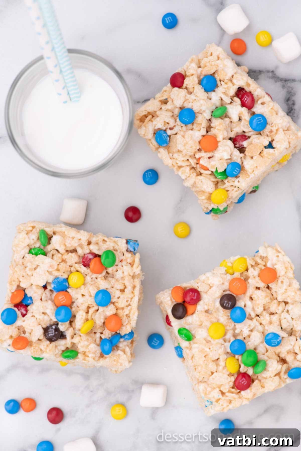 Rainbow Chocolate Krispie Squares 8 Finished M&M Rice Krispie Treats, cut into neat squares and ready to be served.