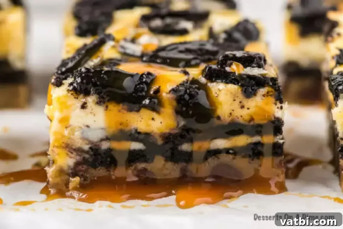 Decadent Loaded Cheesecake Bars 7 Slutty Cheesecake Bars cooling on a wire rack, drizzled generously with warm caramel sauce.