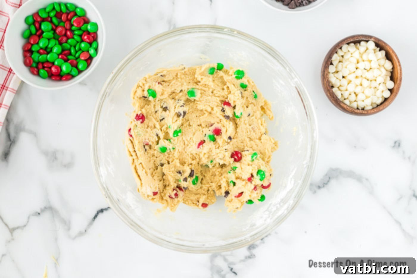 Ultimate Christmas Cookie Bars 4 Cookie dough with M&M's and chocolate chips completely combined.