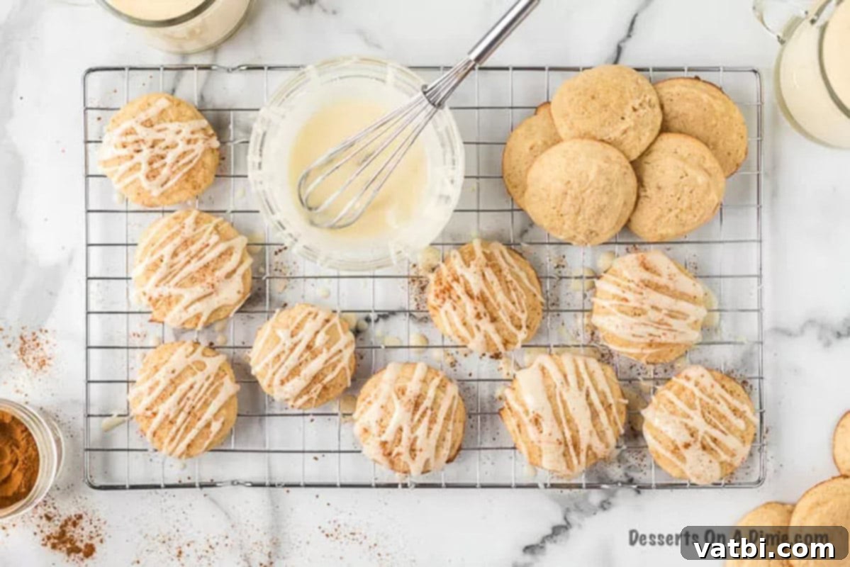 Festive Eggnog Cookies 8 Freshly baked eggnog cookies cooling on a wire rack.