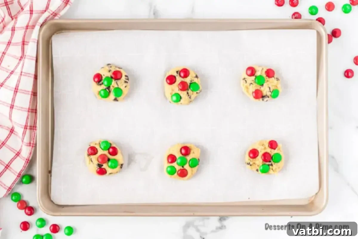Effortless Christmas Cookies for Santa 4 Chocolate Chips pressed into each cookie dough ball.