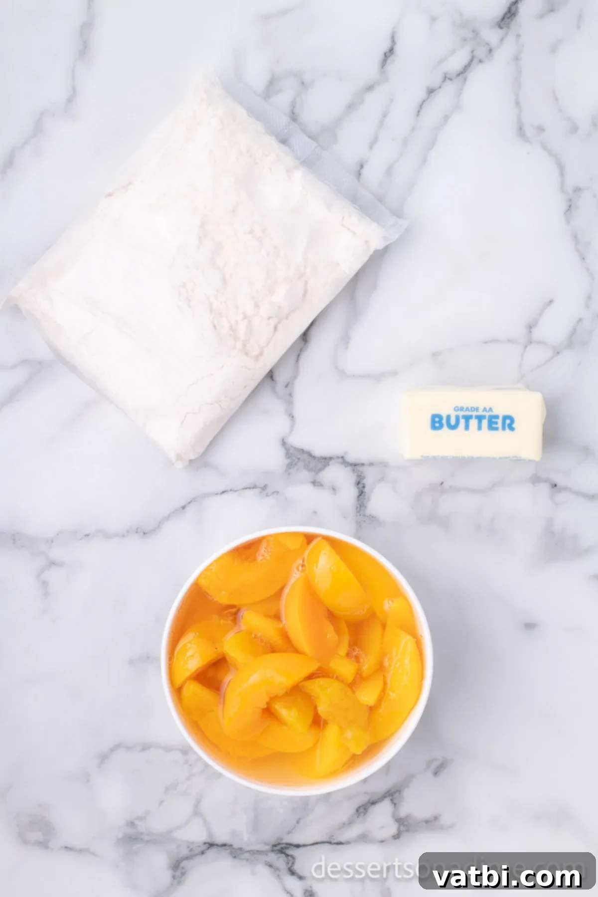 Effortless Slow Cooker Peach Delight 3 Ingredients for dump cake - peaches, yellow cake mix, butter.