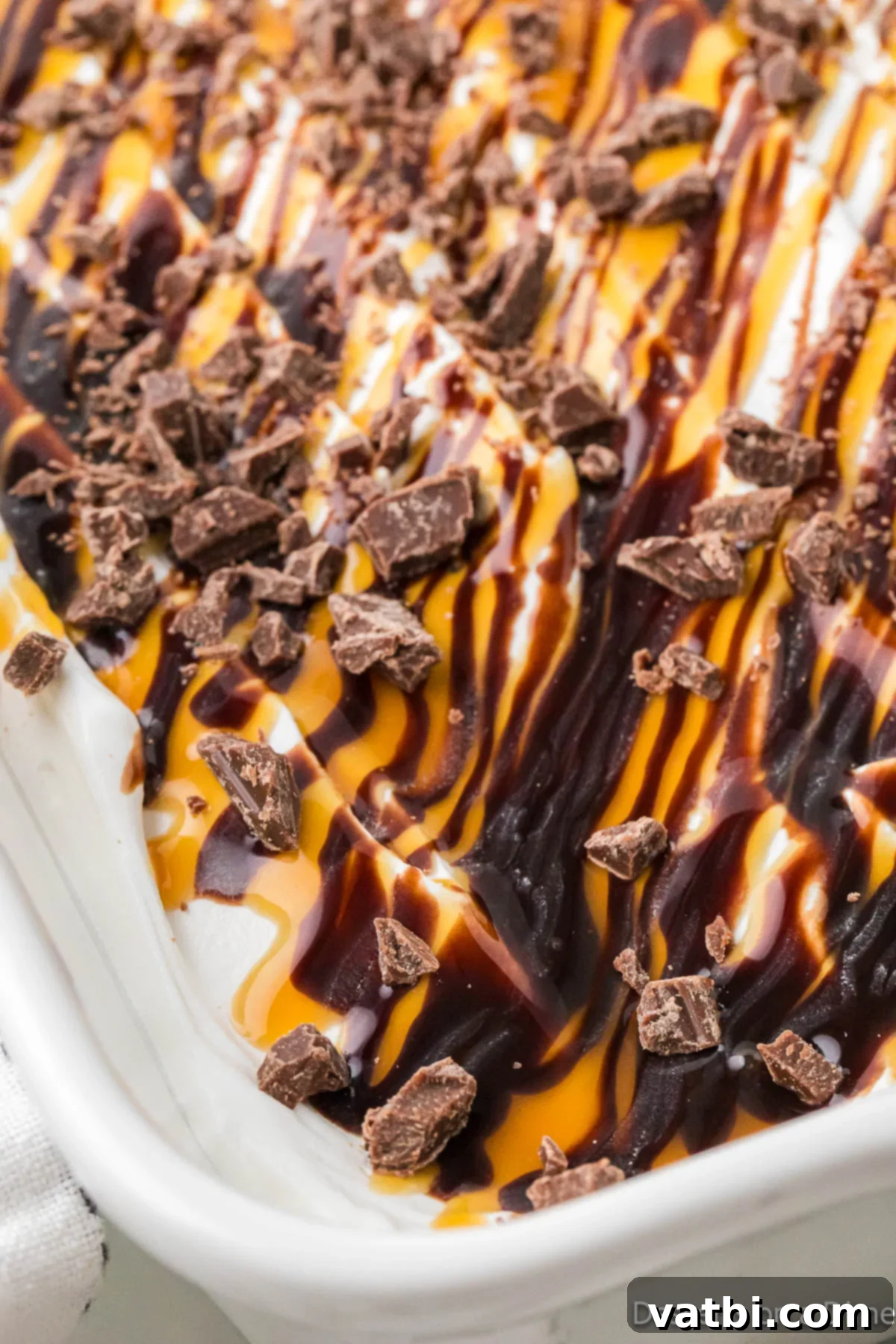 Liquid Gold Chocolate Poke Cake 10 Cake in dish ready to serve.